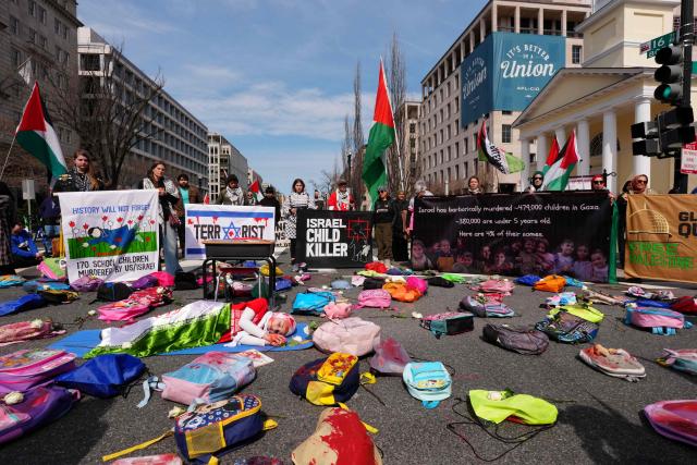 People gather for the International Day of al-Quds (Jerusalem Day) in support of Palestine near the White House in Washington, DC, on March 14, 2026. (Photo by Aaron SCHWARTZ / AFP)
