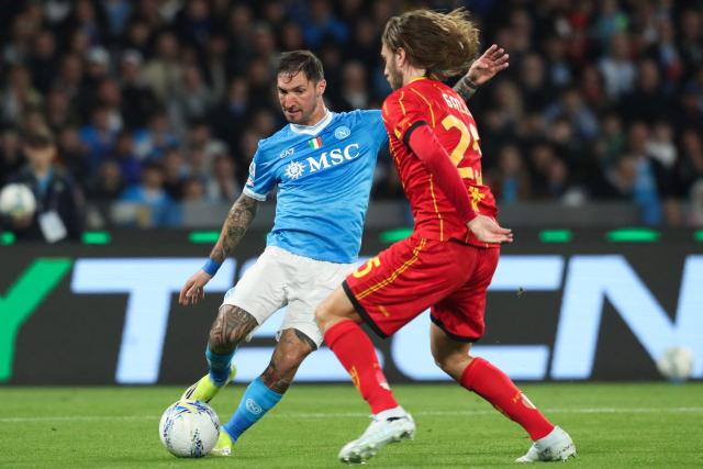 Napoli's Italian forward #21 Matteo Politano (L) fights for the ball with Lecce's Italian defender #25 Antonino Gallo during the Italian Serie A football match between Napoli and Lecce at the Diego Armando Maradona stadium in Naples, southern Italy, on March 14, 2026. (Photo by CARLO HERMANN / AFP)