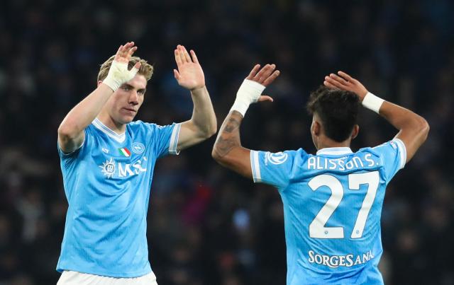 Napoli's Danish forward Rasmus #19 Hojlund celebrates with teammate Napoli's Brazilian forward #27 Allison Santos after scoring his team's first goal during the Italian Serie A football match between Napoli and Lecce at the Diego Armando Maradona stadium in Naples, southern Italy, on March 14, 2026. (Photo by CARLO HERMANN / AFP)