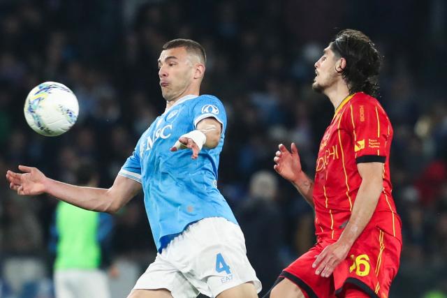 Napoli's Italian defender #4 Alessandro Buongiorno (L) fights for the ball with Lecce's Israeli midfielder #16 Omri Gandelman during the Italian Serie A football match between Napoli and Lecce at the Diego Armando Maradona stadium in Naples, southern Italy, on March 14, 2026. (Photo by CARLO HERMANN / AFP)