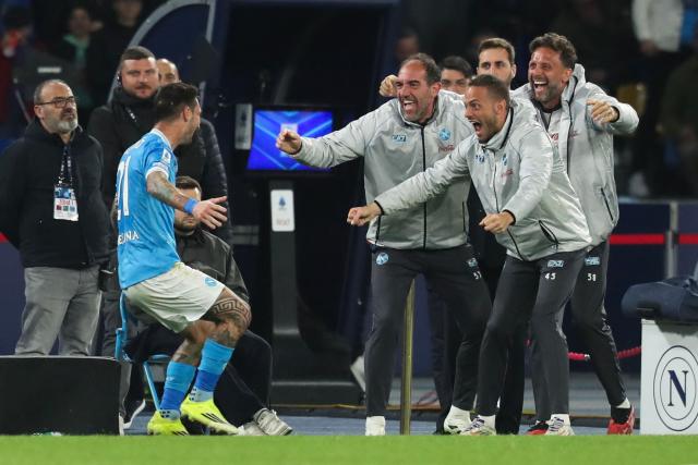 Napoli's Italian forward #21 Matteo Politano (L) celebrates with team members after scoring his team's second goal during the Italian Serie A football match between Napoli and Lecce at the Diego Armando Maradona stadium in Naples, southern Italy, on March 14, 2026. (Photo by CARLO HERMANN / AFP)