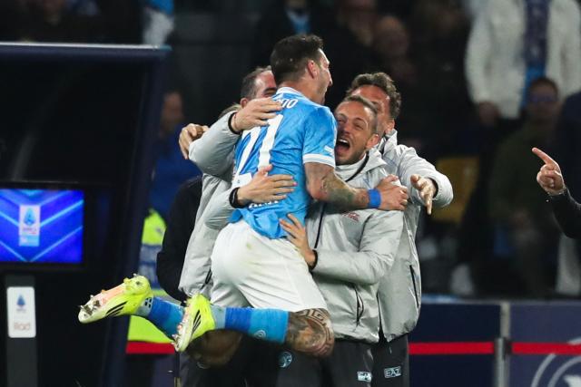 Napoli's Italian forward #21 Matteo Politano (L) celebrates with team members after scoring his team's second goal during the Italian Serie A football match between Napoli and Lecce at the Diego Armando Maradona stadium in Naples, southern Italy, on March 14, 2026. (Photo by CARLO HERMANN / AFP)