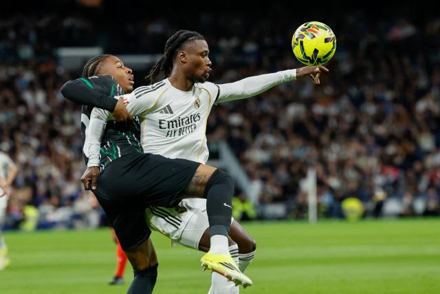 Real Madrid's French midfielder #06 Eduardo Camavinga (R) is challenged by Elche's Spanish midfielder #42 Buba Sangare during the Spanish league football match between Real Madrid CF and Elche CF at the Santiago Bernabeu Stadium in Madrid on March 14, 2026. (Photo by Oscar DEL POZO / AFP)