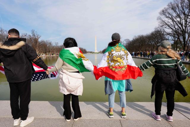 Demonstrators take part in the "Human Chain for Iran" rally around the Reflecting Pool near the Lincoln Memorial in Washington, DC, on March 14, 2026. (Photo by Aaron SCHWARTZ / AFP)
