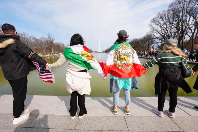 Demonstrators take part in the "Human Chain for Iran" rally around the Reflecting Pool near the Lincoln Memorial in Washington, DC, on March 14, 2026. (Photo by Aaron SCHWARTZ / AFP)