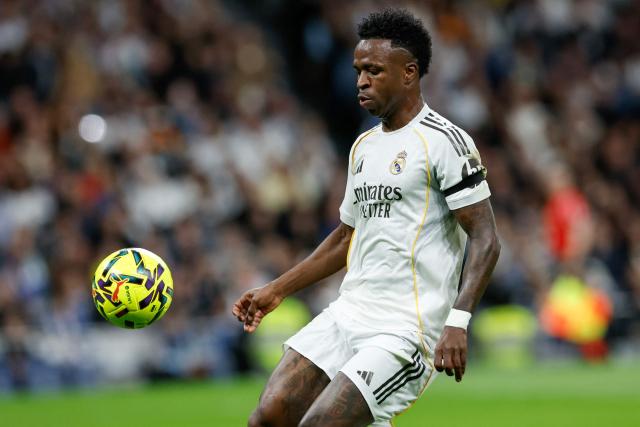 Real Madrid's Brazilian forward #07 Vinicius Junior controls the ball during the Spanish league football match between Real Madrid CF and Elche CF at the Santiago Bernabeu Stadium in Madrid on March 14, 2026. (Photo by Oscar DEL POZO / AFP)