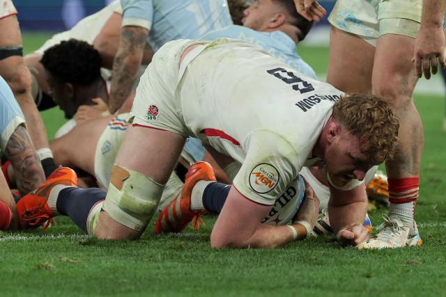 England's lock Ollie Chessum dives over the line to score England's third try during the Six Nations international rugby union match between France and England at the Stade de France, in Saint-Denis, north of Paris, on March 14, 2026. (Photo by Thomas SAMSON / AFP)