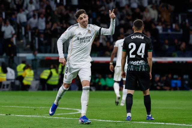 Real Madrid's Uruguayan midfielder #08 Federico Valverde celebrates scoring his team's second goal during the Spanish league football match between Real Madrid CF and Elche CF at the Santiago Bernabeu Stadium in Madrid on March 14, 2026. (Photo by Oscar DEL POZO / AFP)