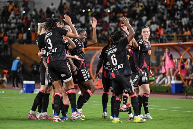 OL-Lyonnes's players celebrate after Haitian midfielder #06 Melchie Dumornay (2ndR) scored a goal during the France LFFP Cup football final match between Paris Saint-Germain (PSG) and OL Lyonnes (Lyon) at the Felix Houphouet-Boigny stadium in Abidjan on March 14, 2026. OL Lyonnes won the inaugural Women’s League Cup, comfortably beating Paris SG 1-0 thanks to a goal from their Haitian striker in Abidjan, Ivory Coast, where the final had been relocated. (Photo by Issouf SANOGO / AFP)