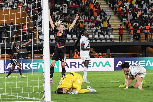 OL-Lyonnes's players celebrate after Haitian midfielder #06 Melchie Dumornay (L) scored a goal during the France LFFP Cup football final match between Paris Saint-Germain (PSG) and OL Lyonnes (Lyon) at the Felix Houphouet-Boigny stadium in Abidjan on March 14, 2026. OL Lyonnes won the inaugural Women’s League Cup, comfortably beating Paris SG 1-0 thanks to a goal from their Haitian striker in Abidjan, Ivory Coast, where the final had been relocated. (Photo by Issouf SANOGO / AFP)