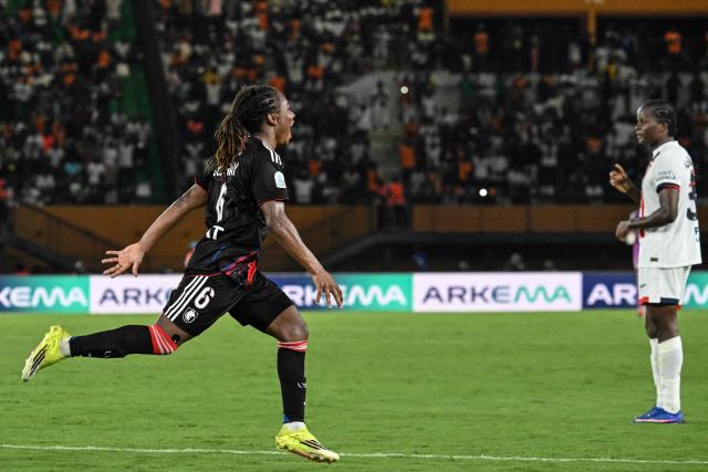 OL-Lyonnes's Haitian midfielder #06 Melchie Dumornay celebrates after scoring a goal during the France LFFP Cup football final match between Paris Saint-Germain (PSG) and OL Lyonnes (Lyon) at the Felix Houphouet-Boigny stadium in Abidjan on March 14, 2026. OL Lyonnes won the inaugural Women’s League Cup, comfortably beating Paris SG 1-0 thanks to a goal from their Haitian striker in Abidjan, Ivory Coast, where the final had been relocated. (Photo by Issouf SANOGO / AFP)