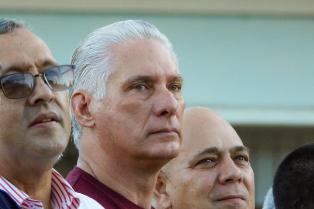 (FILES) (L to -R) Venezuela's ambassador to Cuba Orlando Maneiro, Cuba's President Miguel Diaz-Canel, and the Cuban Communist Party (PCC) Organization Secretary Roberto Morales Ojeda attend an Act of Solidarity with Venezuela, in Havana on October 17, 2025. Cuba's president made a rare admission Saturday that people enduring food shortages and blackouts in his country were unhappy but he condemned overnight violence in an attack on a Communist Party office. (Photo by ADALBERTO ROQUE / AFP)