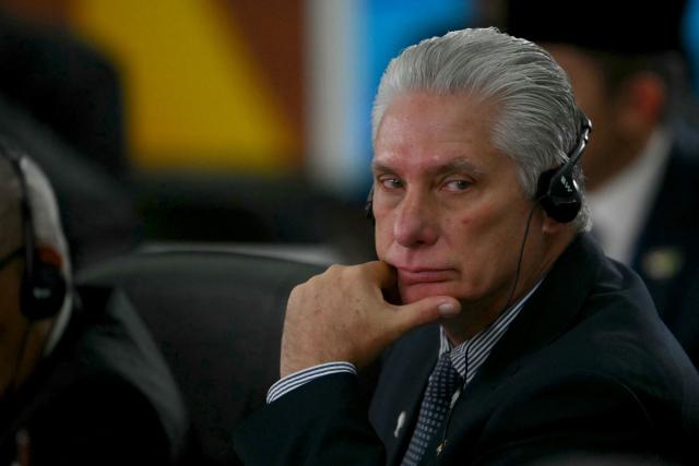 (FILES) Cuba's President and First Secretary Miguel Diaz-Canel attends a plenary session of the BRICS summit in Rio de Janeiro, Brazil, on July 7, 2025. Cuba's president made a rare admission Saturday that people enduring food shortages and blackouts in his country were unhappy but he condemned overnight violence in an attack on a Communist Party office. (Photo by Mauro PIMENTEL / AFP)