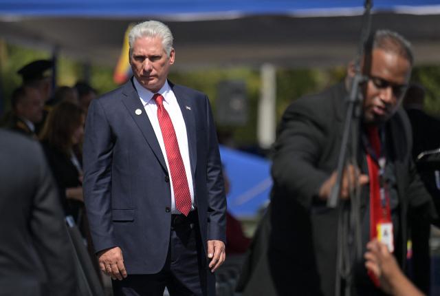 (FILES) Cuba's President Miguel Díaz-Canel arrives for a ceremony at the Fort Tiuna military base during Venezuela's President Nicolas Maduro's inauguration in Caracas on January 10, 2025. Cuba's president made a rare admission Saturday that people enduring food shortages and blackouts in his country were unhappy but he condemned overnight violence in an attack on a Communist Party office. (Photo by JUAN BARRETO / AFP)