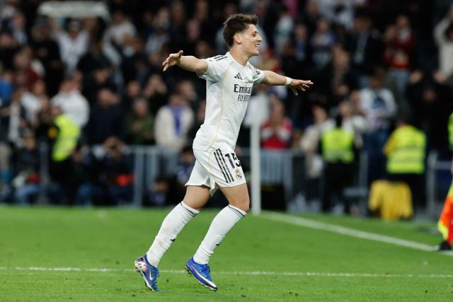 Real Madrid's Turkish midfielder #15 Arda Guler celebrates scoring his team's fourth goal during the Spanish league football match between Real Madrid CF and Elche CF at the Santiago Bernabeu Stadium in Madrid on March 14, 2026. (Photo by Oscar DEL POZO / AFP)