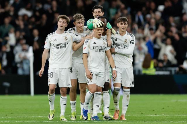 Real Madrid's Turkish midfielder #15 Arda Guler (C) celebrates scoring his team's fourth goal during the Spanish league football match between Real Madrid CF and Elche CF at the Santiago Bernabeu Stadium in Madrid on March 14, 2026. (Photo by Oscar DEL POZO / AFP)