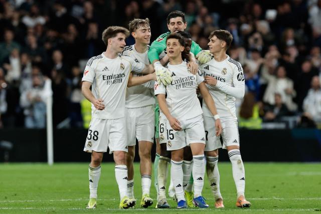 Real Madrid's Turkish midfielder #15 Arda Guler (C) celebrates scoring his team's fourth goal during the Spanish league football match between Real Madrid CF and Elche CF at the Santiago Bernabeu Stadium in Madrid on March 14, 2026. (Photo by Oscar DEL POZO / AFP)