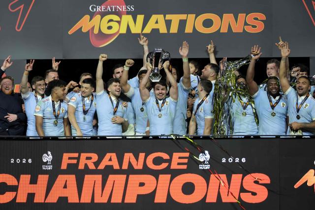 France's captain Antoine Dupont lifts the Six Nations Trophy alongside teammates as they celebrate winning the Six Nations championship at the end of the match against England at the Stade de France, in Saint-Denis, north of Paris, on March 14, 2026. (Photo by Thomas SAMSON / AFP)