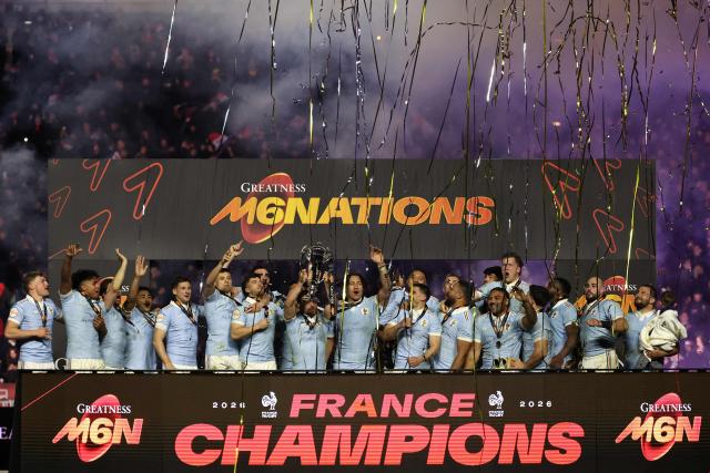 France's captain Antoine Dupont lifts the Six Nations Trophy alongside teammates as they celebrate winning the Six Nations championship at the end of the match against England at the Stade de France, in Saint-Denis, north of Paris, on March 14, 2026. (Photo by FRANCK FIFE / AFP)
