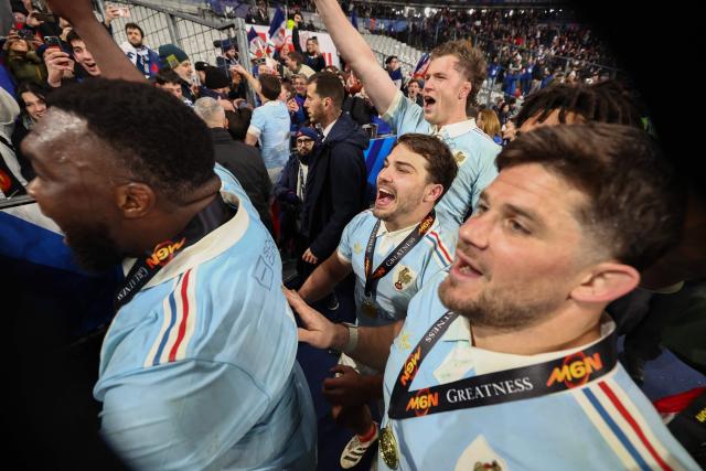France's scrum-half Antoine Dupont (C) celebrates winning the tournament with teammates  following the Six Nations international rugby union match between France and England at the Stade de France, in Saint-Denis, north of Paris, on March 14, 2026. (Photo by FRANCK FIFE / AFP)