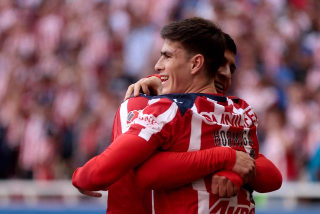 Guadalajara's forward #34 Armando Gonzalez (R) celebrates scoring his team's first goal during the Liga MX Clausura football match between Guadalajara and Santos Laguna at the Akron Stadium in Zapopan, Mexico on March 14, 2026. (Photo by Ulises RUIZ / AFP)
