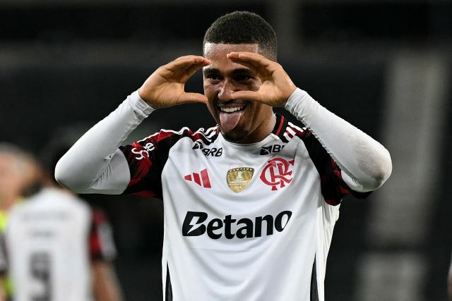 Flamengo's forward #16 Samuel Lino celebrates scoring the opening goal during the Brazilian Championship Serie A football match between Botafogo and Flamengo at the Nilton Santos Stadium in Rio de Janeiro, Brazil on March 14, 2026. (Photo by Mauro PIMENTEL / AFP)