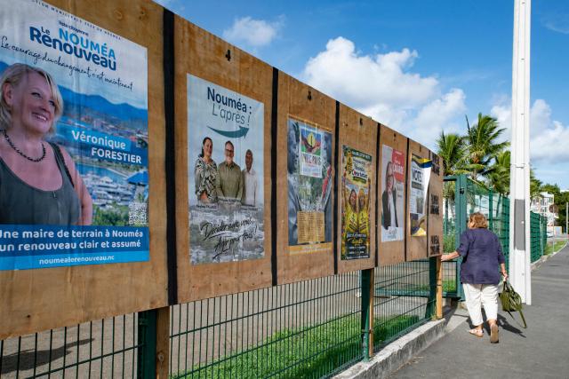 A photo shows campaign posters during the first round of France's 2026 municipal elections outside the Anse Vata Sports Arena in Noumea, in the French overseas collectivity of New Caledonia, on March 15, 2026. (Photo by Delphine MAYEUR / AFP)