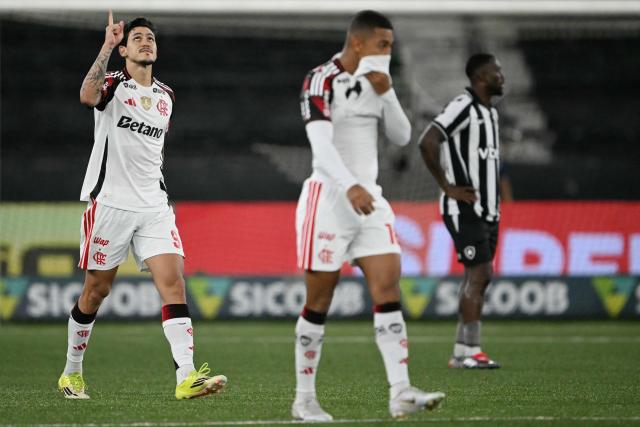 Flamengo's forward #09 Pedro celebrates scoring his team's third goal during the Brazilian Championship Serie A football match between Botafogo and Flamengo at the Nilton Santos Stadium in Rio de Janeiro, Brazil on March 14, 2026. (Photo by MAURO PIMENTEL / AFP)