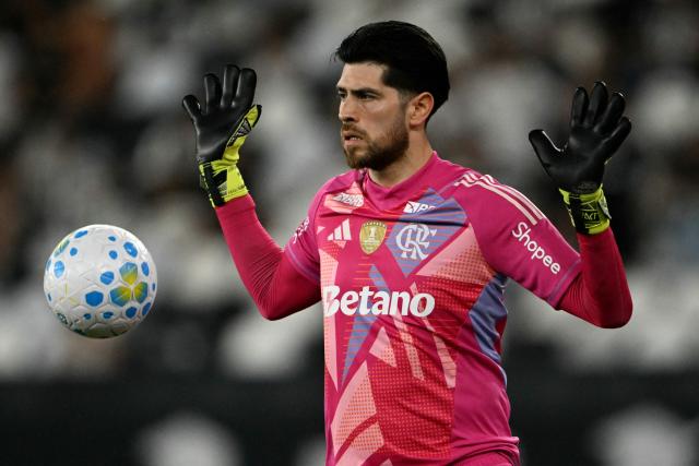 Flamengo's Argentine goalkeeper #01 Agustin Rossi stops the ball during the Brazilian Championship Serie A football match between Botafogo and Flamengo at the Nilton Santos Stadium in Rio de Janeiro, Brazil on March 14, 2026. (Photo by MAURO PIMENTEL / AFP)