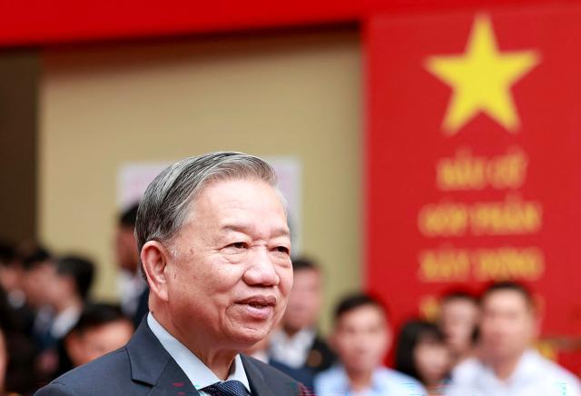 Vietnam's Communist Party Secretary General To Lam speaks to members of the media after casting his ballot at a voting station in Hanoi on March 15, 2026. Polls opened in Vietnam with voters casting ballots for members of the National Assembly, the country's top legislative body that serves mainly to ratify decisions by the ruling Communist Party. (Photo by -STR / AFP)