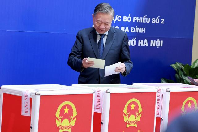 Vietnam's Communist Party Secretary General To Lam casts his ballot at a voting station in Hanoi on March 15, 2026. Polls opened in Vietnam with voters casting ballots for members of the National Assembly, the country's top legislative body that serves mainly to ratify decisions by the ruling Communist Party. (Photo by -STR / AFP)