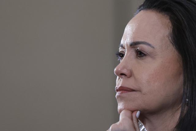 (FILES) Venezuelan opposition leader Maria Corina Machado looks on as she delivers a press conference in Santiago, on March 12, 2026. Venezuelan opposition leader and Nobel Peace Prize laureate Marнa Corina Machado said on March 14, 2025, that “selective justice” is being applied in Venezuela after her lawyer—who was arrested following Nicolбs Maduro’s controversial reelection—was denied amnesty. (Photo by Raul BRAVO / AFP)