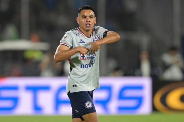 Cruz Azul's midfielder #19 Carlos Rodriguez celebrates scoring his team's second goal during the Liga MX Clausura match between Pumas and Cruz Azul at the Olimpico Universitario Stadium in Mexico City on March 14, 2026. (Photo by Alfredo ESTRELLA / AFP)