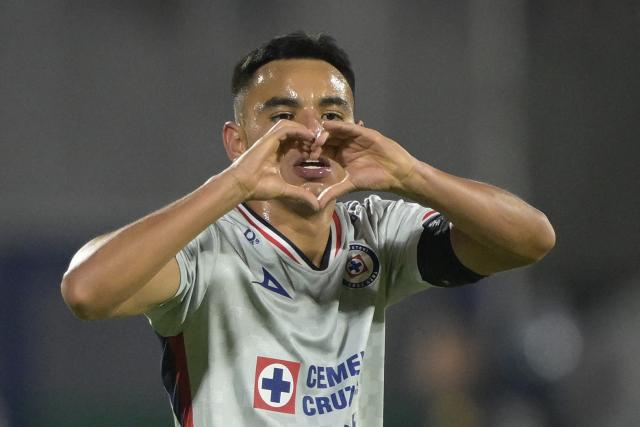 Cruz Azul's midfielder #19 Carlos Rodriguez celebrates scoring his team's second goal during the Liga MX Clausura match between Pumas and Cruz Azul at the Olimpico Universitario Stadium in Mexico City on March 14, 2026. (Photo by Alfredo ESTRELLA / AFP)