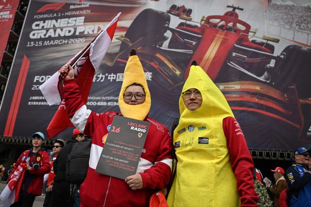 Supporters of Ferrari's Monegasque driver Charles Leclerc pose as they arrive for the Formula One Chinese Grand Prix at the Shanghai International Circuit in Shanghai on March 15, 2026. (Photo by Jade GAO / AFP)