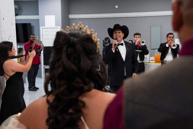 Latin Grammy winner and Democrat candidate for Texas' 15th Congressional District Bobby Pulido sings at a quinceanera party in Edinburg, Texas, on March 14, 2026. (Photo by Gabriel V. Cardenas / POOL / AFP)