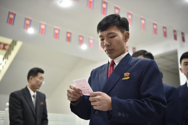 People vote for Pak Ji Min, president of Kim Chaek University of Technology, at the election site of the Sub-constituency No. 39 of Constituency No. 10, in Pyongyang on March 15, 2026. (Photo by KIM Won Jin / AFP)