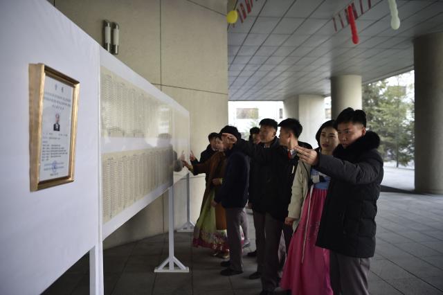 People vote for Pak Ji Min, president of Kim Chaek University of Technology, at the election site of the Sub-constituency No. 39 of Constituency No. 10, in Pyongyang on March 15, 2026. (Photo by KIM Won Jin / AFP)