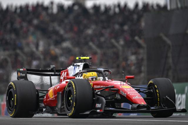 Ferrari's British driver Lewis Hamilton competes during the Formula One Chinese Grand Prix at the Shanghai International Circuit in Shanghai on March 15, 2026. (Photo by JADE GAO / AFP)