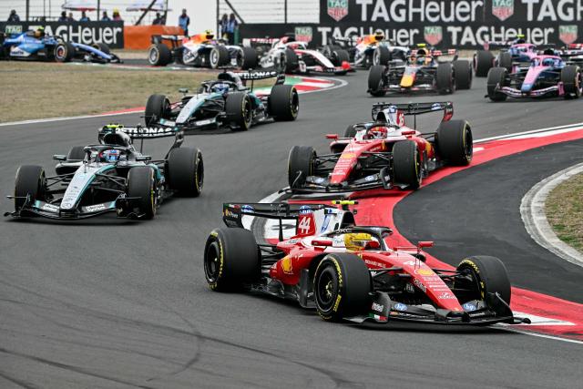Ferrari's British driver Lewis Hamilton leads during the Formula One Chinese Grand Prix at the Shanghai International Circuit in Shanghai on March 15, 2026. (Photo by Greg Baker / AFP)