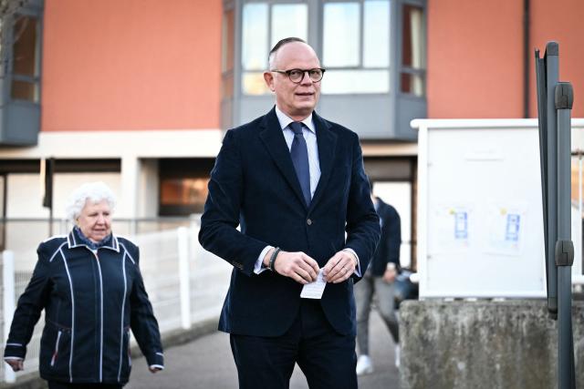 Le Havre incumbent mayor and center-right Horizons party candidate for his re-election Edouard Philippe arrives at the voting station prior to cast his ballot during the first round of France's 2026 municipal elections in Le Havre, northeastern France, on March 15, 2026. (Photo by Lou BENOIST / AFP)