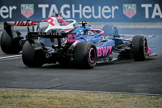 Alpine's Argentine driver Franco Colapinto (front) collides with Haas F1 Team's French driver Esteban Ocon during the Formula One Chinese Grand Prix at the Shanghai International Circuit in Shanghai on March 15, 2026. (Photo by Greg Baker / AFP)
