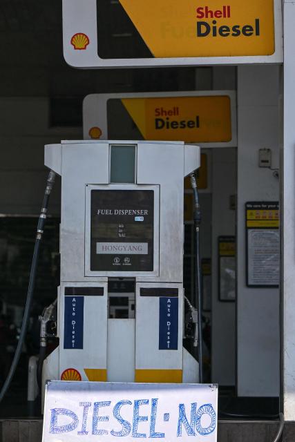 A signage board reading 'No Diesel' is displayed at a fuel station in Biyagama on the outskirts of Colombo on March 15, 2026. In neighbouring Sri Lanka, authorities raised LPG prices by eight percent on March 11, a day after increasing fuel prices by a similar percentage. (Photo by Ishara S. KODIKARA / AFP)