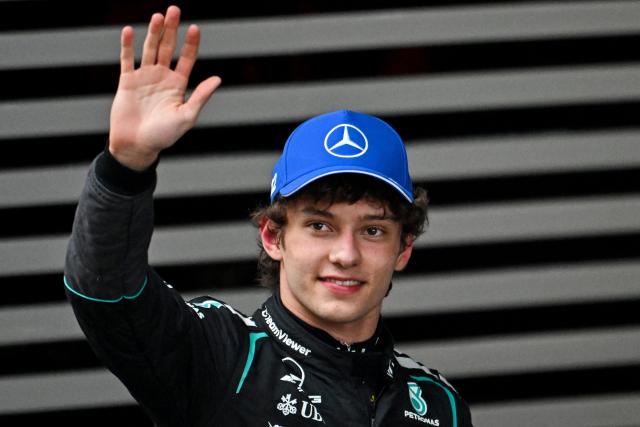 Mercedes' Italian driver Kimi Antonelli celebrates winning the Formula One Chinese Grand Prix at the Shanghai International Circuit in Shanghai on March 15, 2026. (Photo by JADE GAO / AFP)