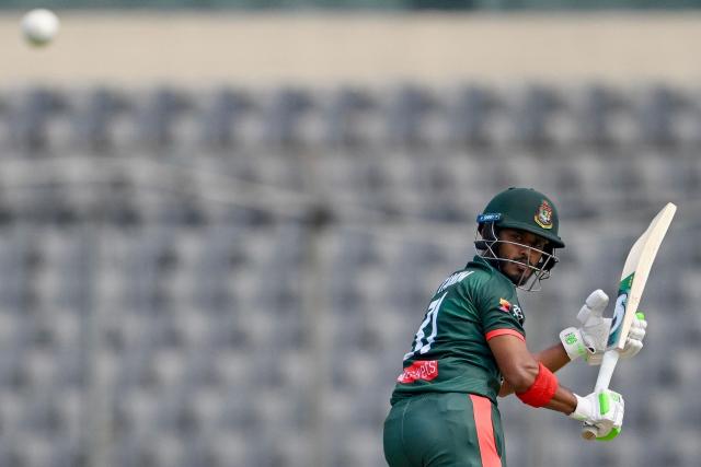 Bangladesh's Tanzid Hasan Tamim watches the ball after playing a shot during the third one-day international (ODI) cricket match between Bangladesh and Pakistan at Sher-e-Bangla National Stadium in Mirpur on March 15, 2026. (Photo by MUNIR UZ ZAMAN / AFP)
