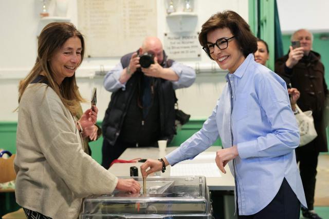 Right-wing Les Republicains (LR) party candidate in Paris, Rachida Dati (R) casts her ballot during the first round of France's 2026 municipal elections in Paris on March 15, 2026. (Photo by Thomas SAMSON / AFP)