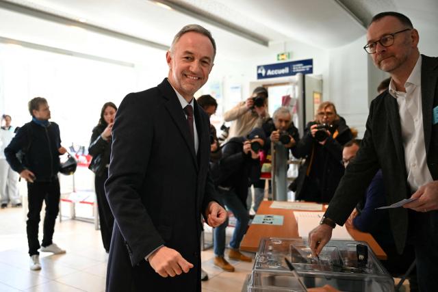 Socialist party (PS) mayoral candidate in Paris, Emmanuel Gregoire smiles after casting his vote during the first round of France's 2026 municipal elections in Paris on March 15, 2026. (Photo by Bertrand GUAY / POOL / AFP)