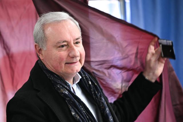 Toulouse's incumbent mayor and centre-right/right-wing coalition candidate for his re-election Jean-Luc Moudenc reacts as he leaves the polling booth to cast his ballot during the first round of France's 2026 municipal elections in Toulouse, southwestern France, on March 15, 2026. (Photo by Lionel BONAVENTURE / AFP)
