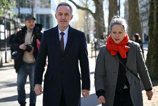 Socialist party (PS) mayoral candidate in Paris, Emmanuel Gregoire (L), next to French mayoral candidate for Paris' 12th arrondissement Lucie Castets, arrives to the polling station to cast his vote during the first round of France's 2026 municipal elections in Paris on March 15, 2026. (Photo by Bertrand GUAY / AFP)