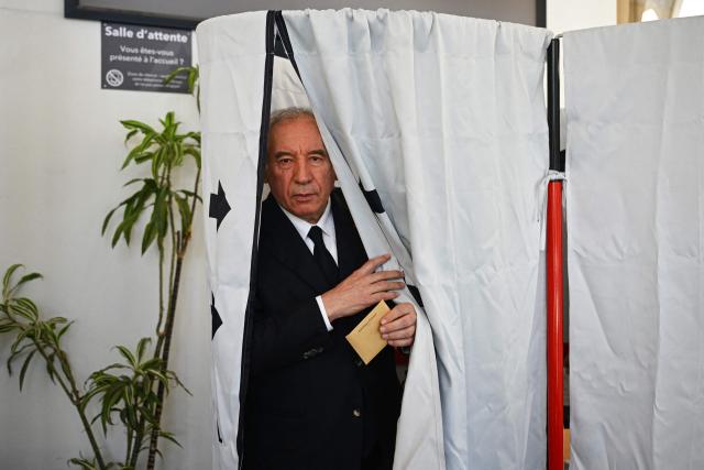 Incumbent mayor of Pau and centrist MoDem party candidate for re-election Francois Bayrou exits a polling booth prior to casting his ballot during the first round of France's 2026 municipal elections in Pau, southwestern France, on March 15, 2026. (Photo by GAIZKA IROZ / AFP)